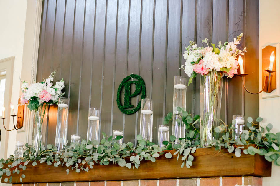 Flowers and candles are arranged on the mantle, I'ON Creek Club, Mt Pleasant, South Carolina Kate Timbers Photography. http://katetimbers.com #katetimbersphotography // Charleston Photography // Inspiration