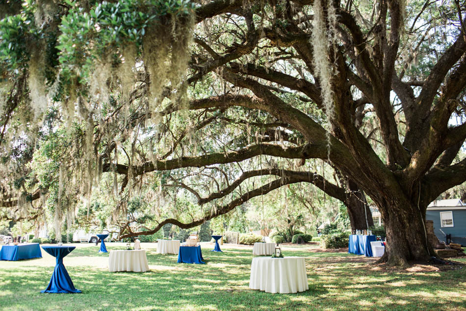 Lanterns are set on tables under an oak tree, Oakland Plantation, Mt Pleasant, South Carolina Kate Timbers Photography. http://katetimbers.com #katetimbersphotography // Charleston Photography // Inspiration