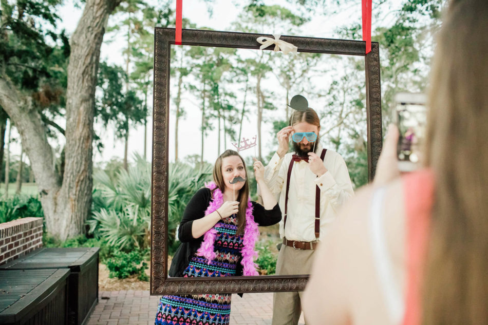 Guests have fun with photo frame, Indigo Run Clubhouse, Hilton Head, South Carolina Kate Timbers Photography. http://katetimbers.com #katetimbersphotography // Charleston Photography // Inspiration