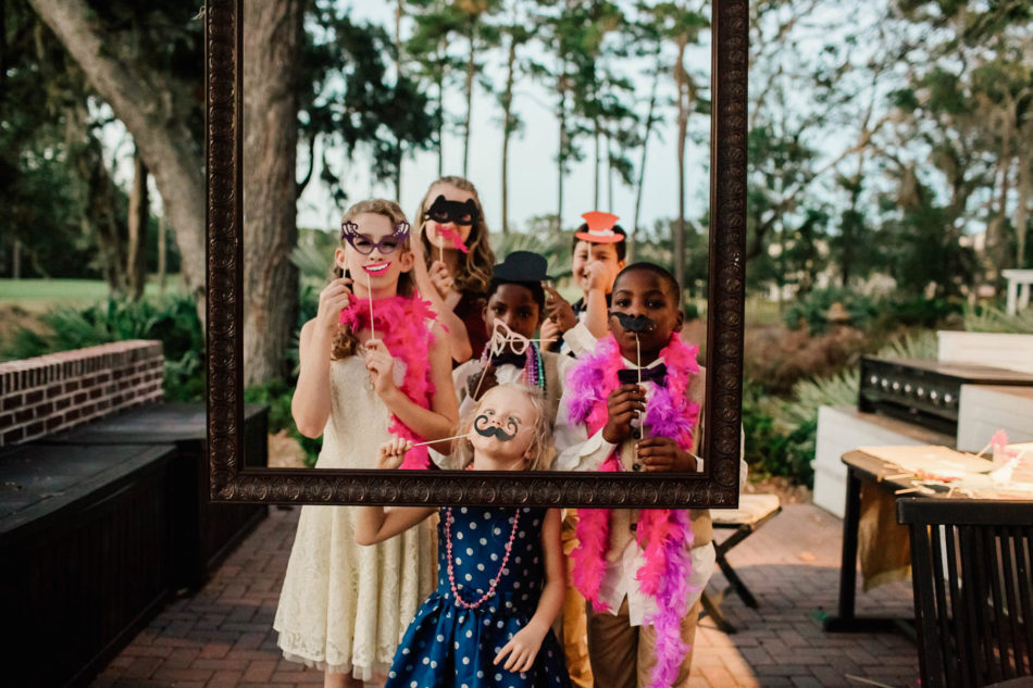 Guests have fun with photo frame, Indigo Run Clubhouse, Hilton Head, South Carolina Kate Timbers Photography. http://katetimbers.com #katetimbersphotography // Charleston Photography // Inspiration