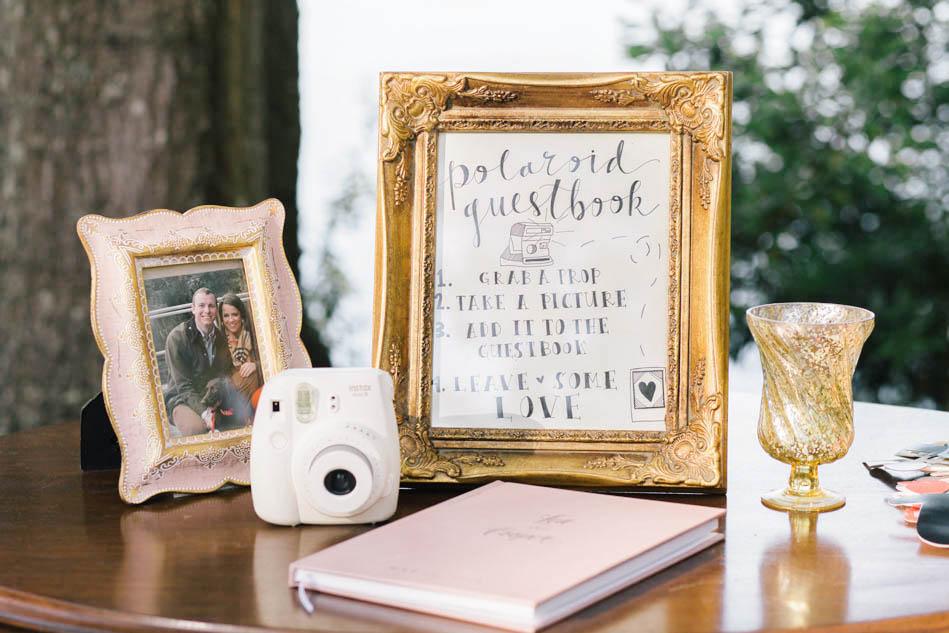 A photo booth is set up with a hanging golden frame, Wadmalaw Island, South Carolina Kate Timbers Photography. http://katetimbers.com #katetimbersphotography // Charleston Photography // Inspiration