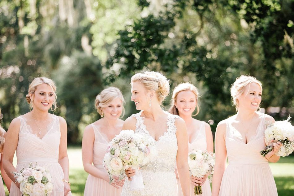 Bride poses with bridesmaids, Magnolia Plantation, Charleston, South Carolina Kate Timbers Photography. http://katetimbers.com #katetimbersphotography // Charleston Photography // Inspiration