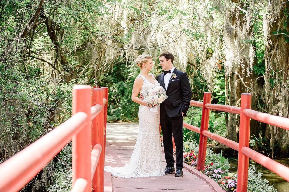 Bride and groom pose on red bridge, Magnolia Plantation, Charleston, South Carolina Kate Timbers Photography. http://katetimbers.com #katetimbersphotography // Charleston Photography // Inspiration