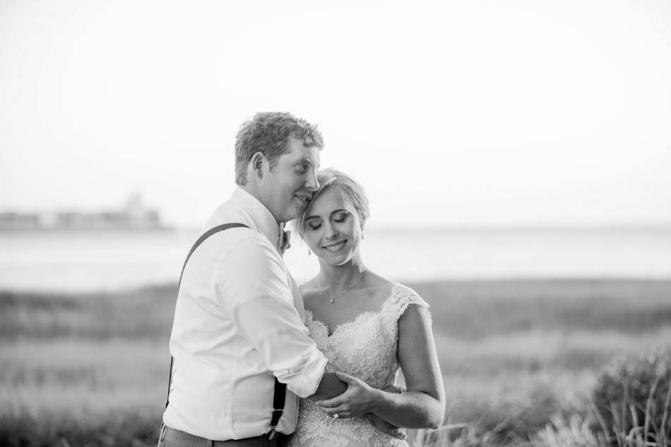 Bride and groom stand near Ravenel Bridge at sunset, Alhambra Hall, Mt Pleasant, South Carolina Kate Timbers Photography. http://katetimbers.com #katetimbersphotography // Charleston Photography // Inspiration