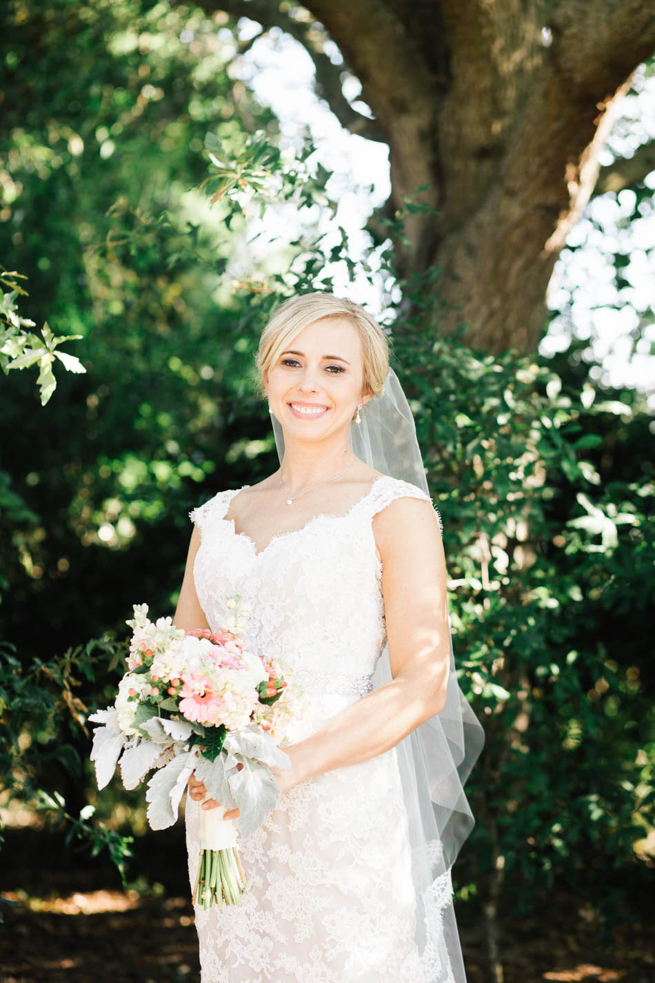 Bride stands among the trees, Alhambra Hall, Mt Pleasant, South Carolina Kate Timbers Photography. http://katetimbers.com #katetimbersphotography // Charleston Photography // Inspiration