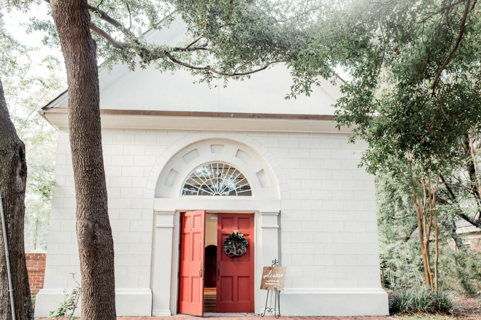A wood initial stencil over a wreath sits at entrance of Coleman Hall, Mt Pleasant, South Carolina Kate Timbers Photography. http://katetimbers.com #katetimbersphotography // Charleston Photography // Inspiration