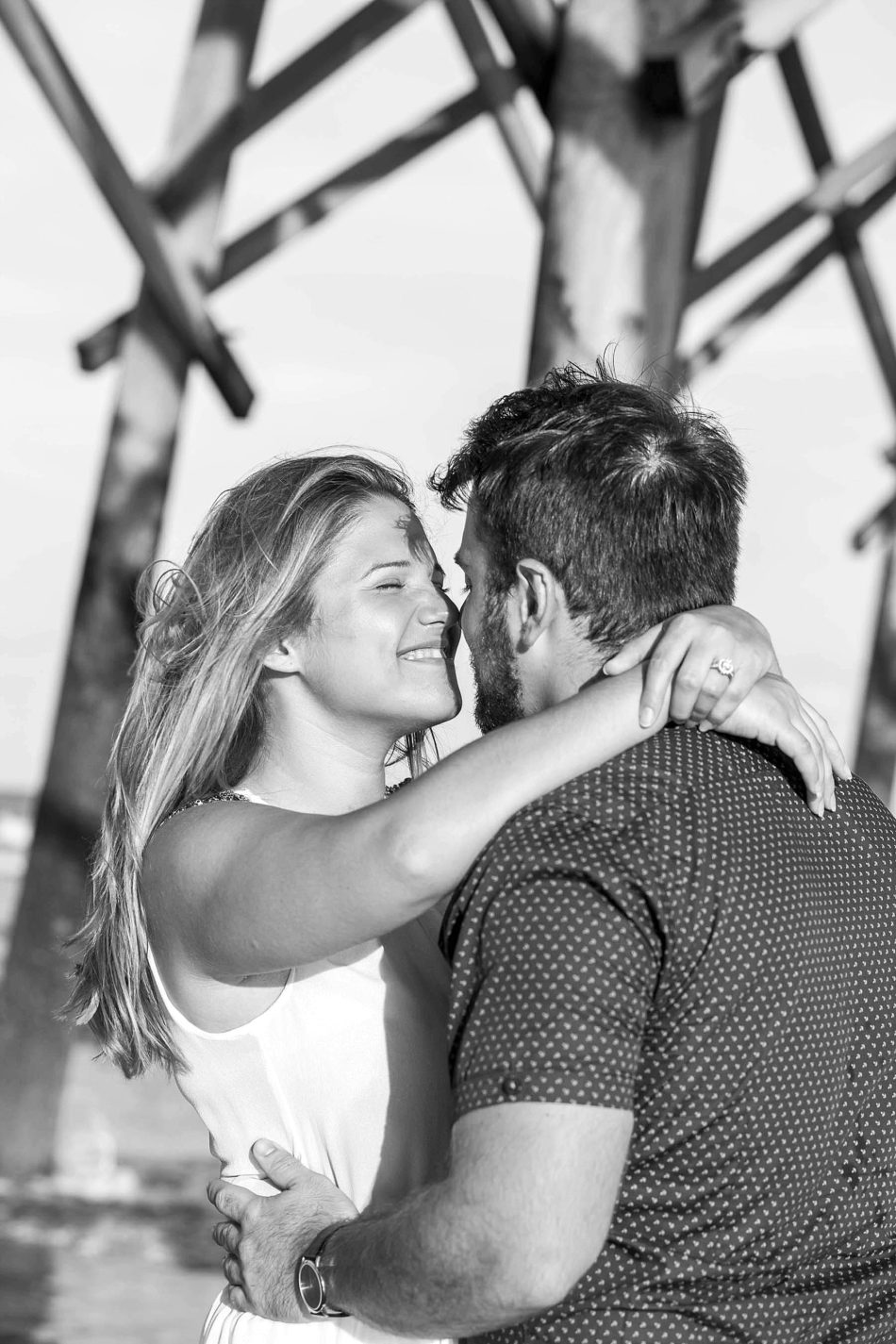 Engaged Couple under fishing pier, Folly beach in Charleston, South Carolina Kate Timbers Photography. http://katetimbers.com #katetimbersphotography // Charleston Photography // Inspiration