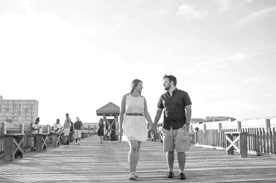 Engaged Couple walk on pier, Folly beach in Charleston, South Carolina Kate Timbers Photography. http://katetimbers.com #katetimbersphotography // Charleston Photography // Inspiration