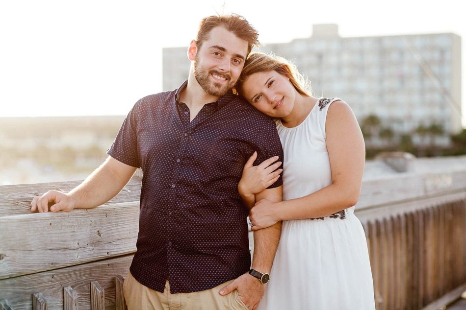 Engaged Couple at sunset on pier, Folly beach in Charleston, South Carolina Kate Timbers Photography. http://katetimbers.com #katetimbersphotography // Charleston Photography // Inspiration