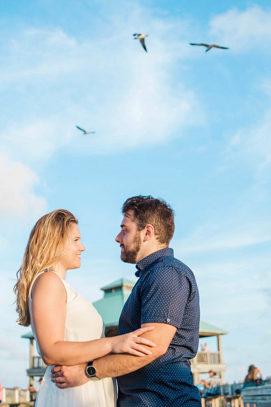 Birds fly over engaged couple, Folly beach in Charleston, South Carolina Kate Timbers Photography. http://katetimbers.com #katetimbersphotography // Charleston Photography // Inspiration
