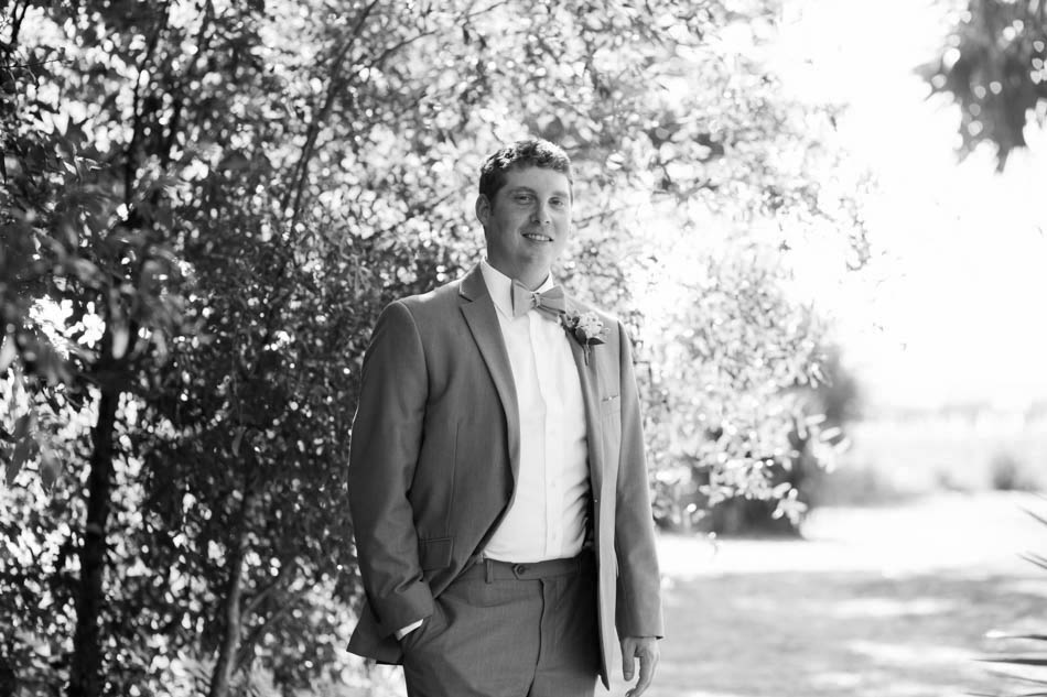 Groom stands among the trees, Alhambra Hall, Mt Pleasant, South Carolina Kate Timbers Photography. http://katetimbers.com #katetimbersphotography // Charleston Photography // Inspiration