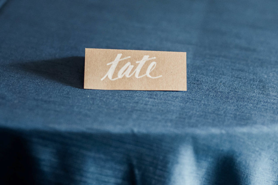 Escort cards are on brown paper with white calligraphy, Coleman Hall, Mt Pleasant, South Carolina Kate Timbers Photography. http://katetimbers.com #katetimbersphotography // Charleston Photography // Inspiration