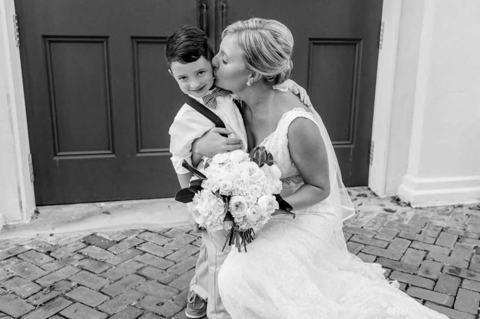 Bride poses with ringbearer, Coleman Hall, Mt Pleasant, South Carolina Kate Timbers Photography. http://katetimbers.com #katetimbersphotography // Charleston Photography // Inspiration