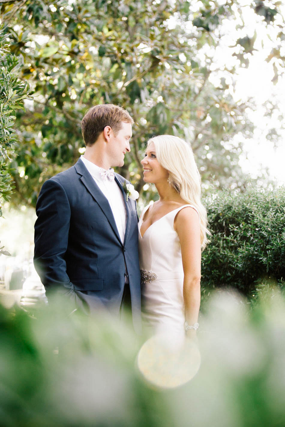 Bride and groom snuggle at the Rice Mill Building, Charleston, South Carolina Kate Timbers Photography. http://katetimbers.com #katetimbersphotography // Charleston Photography // Inspiration