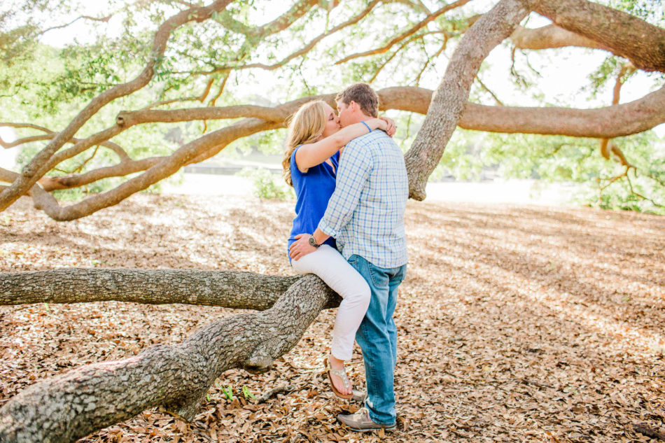 Engaged couple cuddle underneath an oak tree, Hampton Park, Charleston, South Carolina Kate Timbers Photography. http://katetimbers.com #katetimbersphotography // Charleston Photography // Inspiration