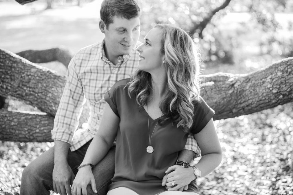 Engaged couple cuddle underneath an oak tree, Hampton Park, Charleston, South Carolina Kate Timbers Photography. http://katetimbers.com #katetimbersphotography // Charleston Photography // Inspiration