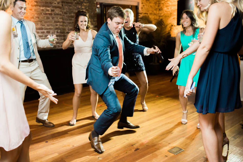 Guests dance at reception, Rice Mill Building, Charleston, South Carolina Kate Timbers Photography. http://katetimbers.com #katetimbersphotography // Charleston Photography // Inspiration
