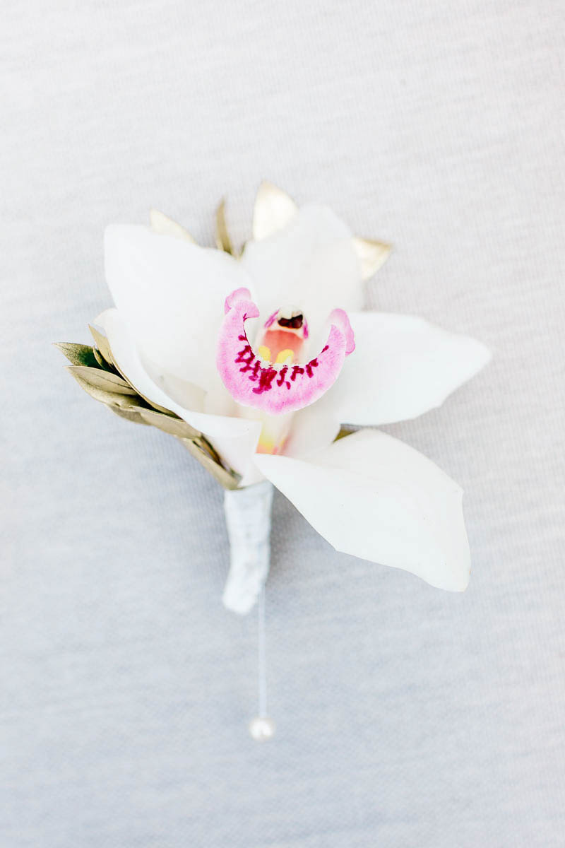 Boutonniere has orchid pinned, Grand Bohemian, Charleston, South Carolina Kate Timbers Photography. http://katetimbers.com #katetimbersphotography // Charleston Photography // Inspiration