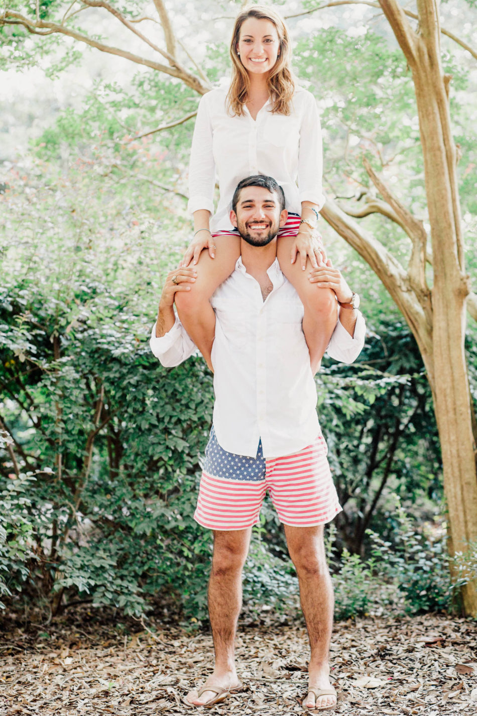 Engaged couple doing a goofy pose with Chubbies American Flag shorts, Hampton Park, Charleston, South Carolina Kate Timbers Photography. http://katetimbers.com #katetimbersphotography // Charleston Photography // Inspiration