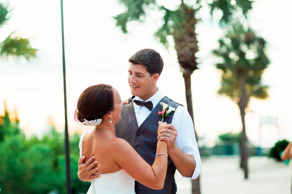 Bride and groom have first dance at Charleston Harbor Marina. www.katetimbers.com