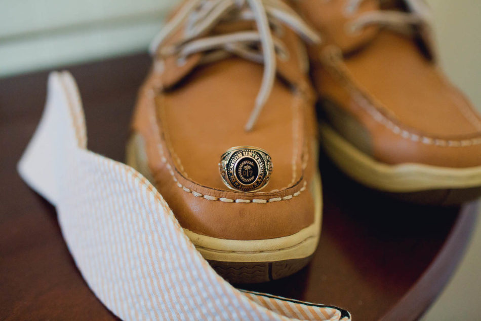 Groom's class ring sits on shoes, Creek Club at I'on, Charleston, South Carolina. Kate Timbers Photography. http://katetimbers.com
