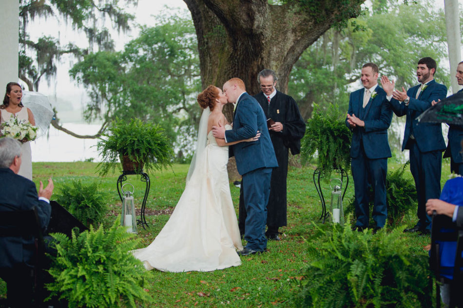 Bride and groom kiss, Old Wide Awake Plantation, Charleston, South Carolina. Kate Timbers Photography. katetimbers.com