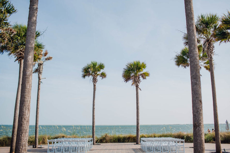 Ceremony is set up by palm trees, Seabrook Island Club, Charleston, South Carolina. www.katetimbers.com