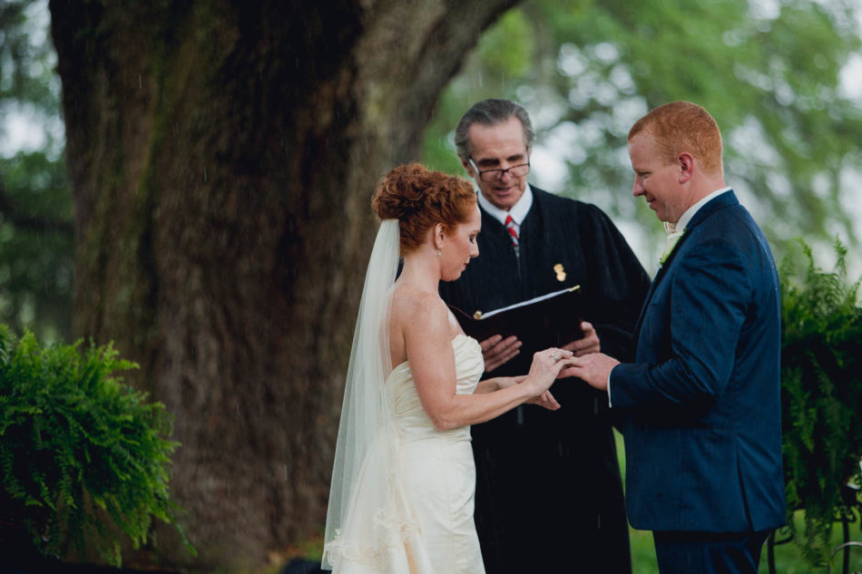 Bride and groom exchange vows, Old Wide Awake Plantation, Charleston, South Carolina. Kate Timbers Photography. katetimbers.com
