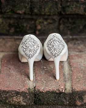 The bride's shoes sit on brick step at Magnolia Plantation, captured by Charleston wedding photographer, Kate Timbers. Kate Timbers Photography. http://katetimbers.com