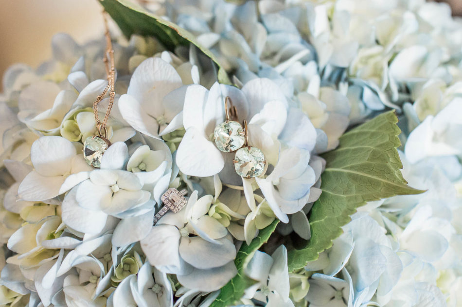 Earrings and necklace lay on hydrangea bouquet, Pepper Plantation, Awendaw, South Carolina. Kate Timbers Photography. http://katetimbers.com