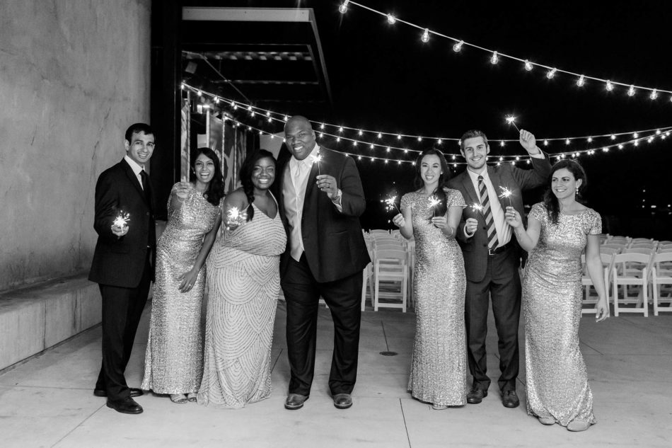 Guests pose at night with sparklers, South Carolina Aquarium. Kate Timbers Photography. http://katetimbers.com