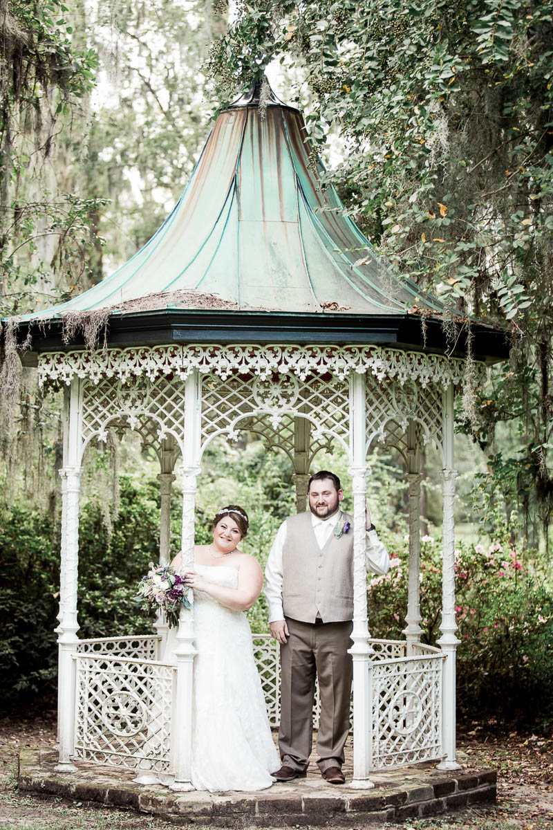 Bride and groom stand in the gazebo, Magnolia Plantation. Kate Timbers Photography. http://katetimbers.com