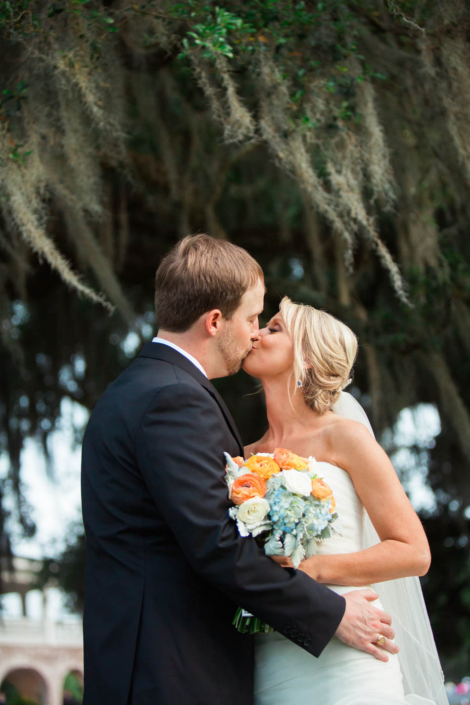 Bride and groom smile under oak trees, Dunes West Golf and River Club, Mt Pleasant, South Carolina. Kate Timbers Photography. http://katetimbers.com