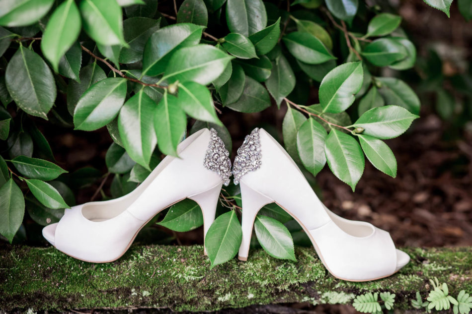 The bride's shoes sit by greenery at Magnolia Plantation by Charleston wedding photographer Kate Timbers. http://katetimbers.com