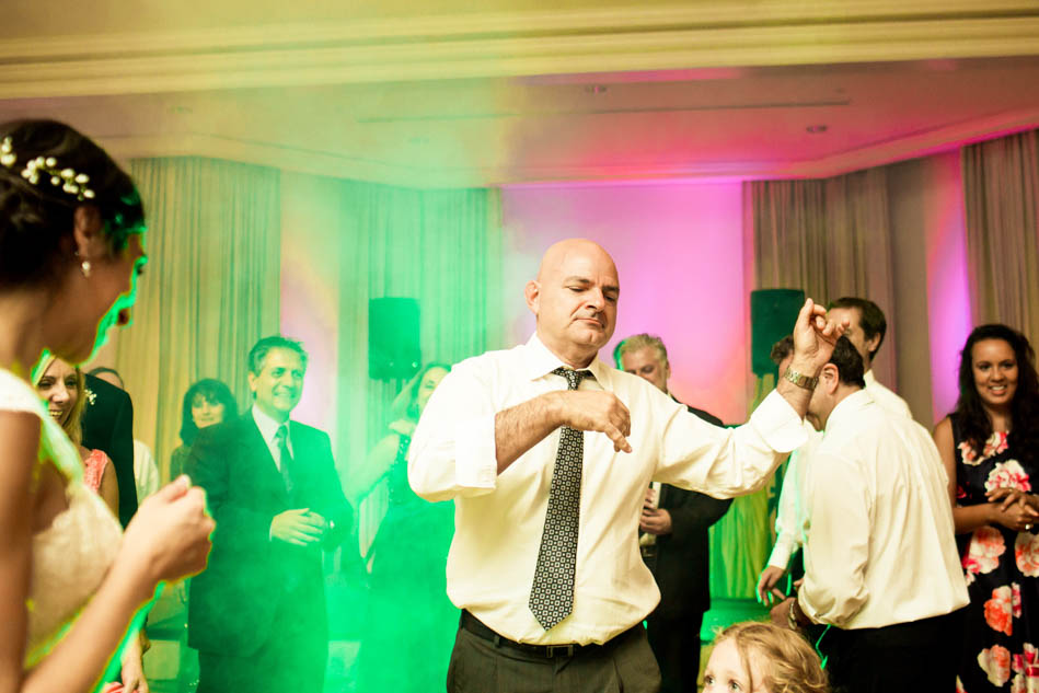 Guests dance at reception with fog, Daniel Island Club. Kate Timbers Photography. http://katetimbers.com