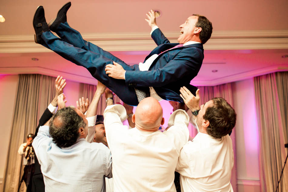 Guests are tossed in the air at reception, Daniel Island Club. Kate Timbers Photography. http://katetimbers.com