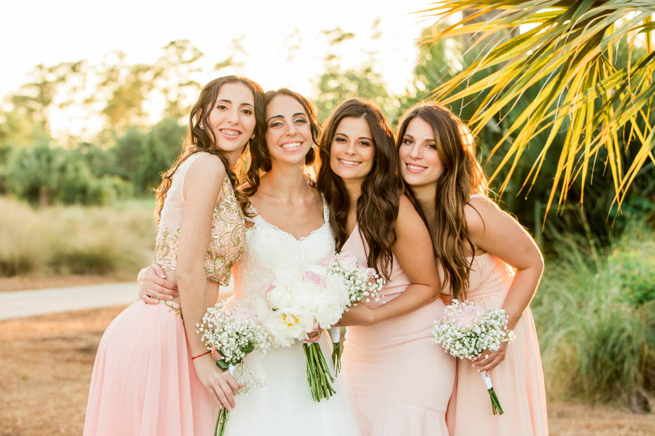 Wedding party pose together, Daniel Island Club. Kate Timbers Photography. http://katetimbers.com