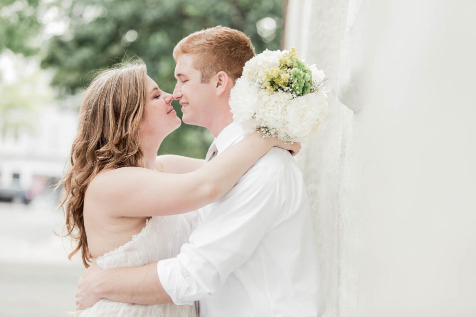 Bride and groom pose together, Downtown Charleston, South Carolina. Kate Timbers Photography. http://katetimbers.com