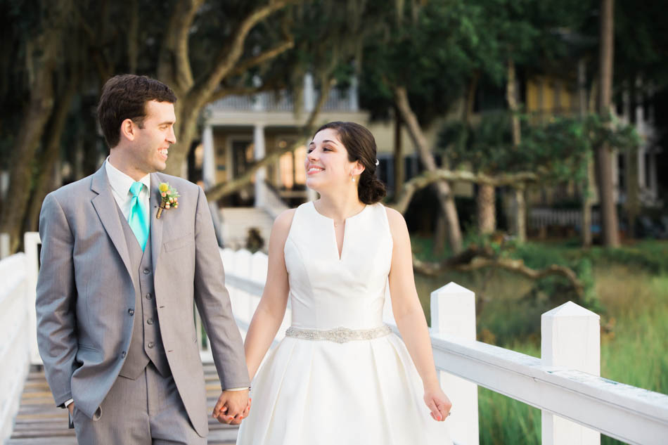 Bride and groom stand on dock, Ion Creek Club, Mt Pleasant, South Carolina. Kate Timbers Photography. http://katetimbers.com