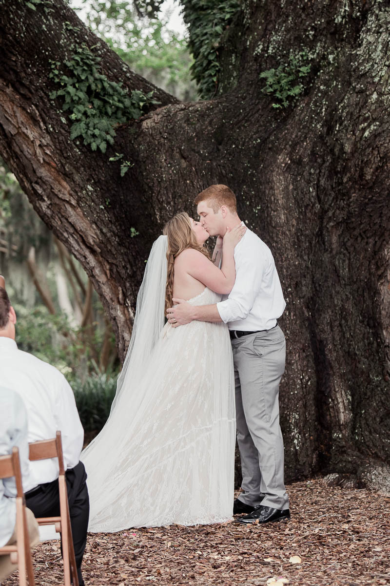 Bride and groom kiss, Hampton Park, Charleston, South Carolina. Kate Timbers Photography. http://katetimbers.com