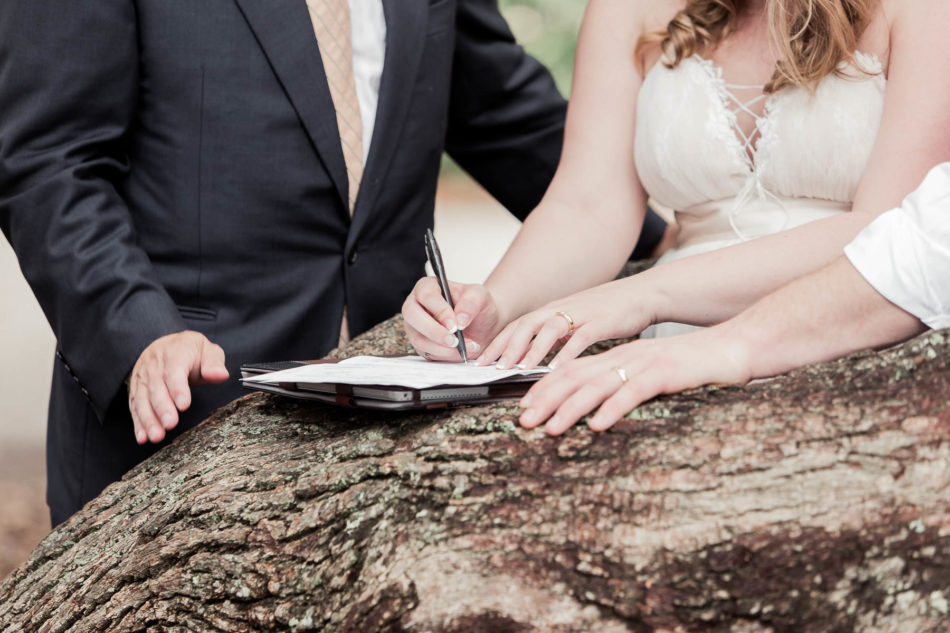 Bride and groom sign marriage license, Hampton Park, Charleston, South Carolina. Kate Timbers Photography. http://katetimbers.com