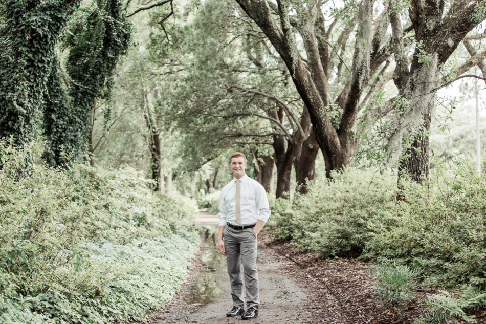Groom poses under trees, Hampton Park, Charleston, South Carolina. Kate Timbers Photography. http://katetimbers.com