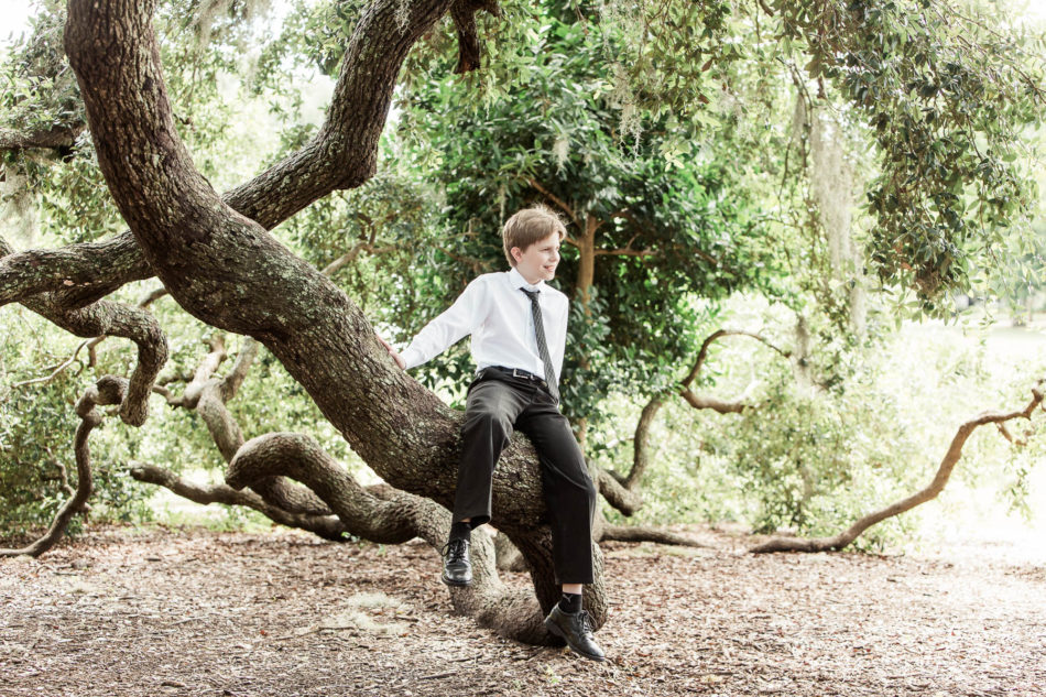 Guest sits on Oak tree branches, Hampton Park, Charleston, South Carolina. Kate Timbers Photography. http://katetimbers.com