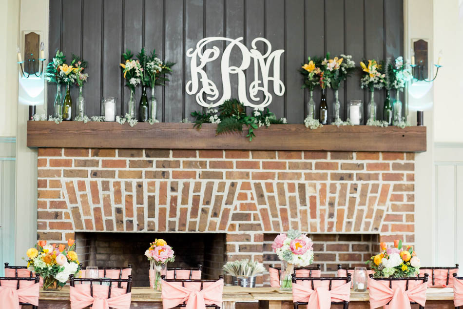 Insignia of bride and groom are placed on the mantle, I'on Creek Club, Mt Pleasant, South Carolina. Kate Timbers Photography. http://katetimbers.com