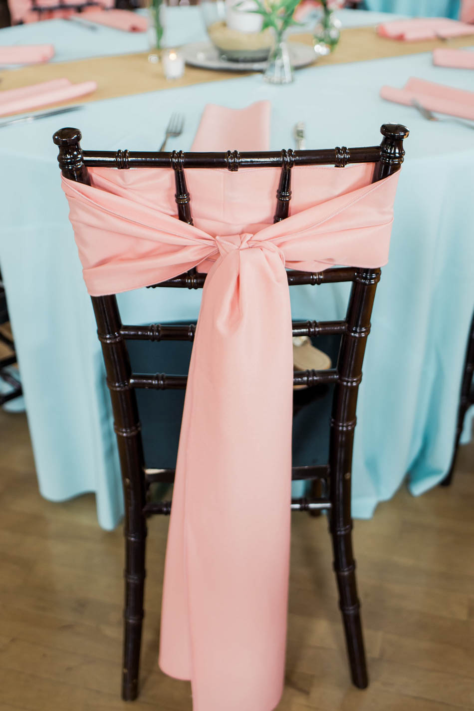 Pink sash is wrapped around chiavari chair, I'on Creek Club, Mt Pleasant, South Carolina. Kate Timbers Photography. http://katetimbers.com