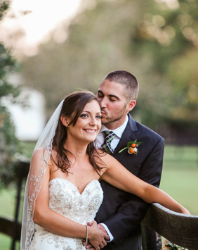 Bride and groom lean on fence, Boone Hall Plantation, Charleston, South Carolina. Kate Timbers Photography. http://katetimbers.com