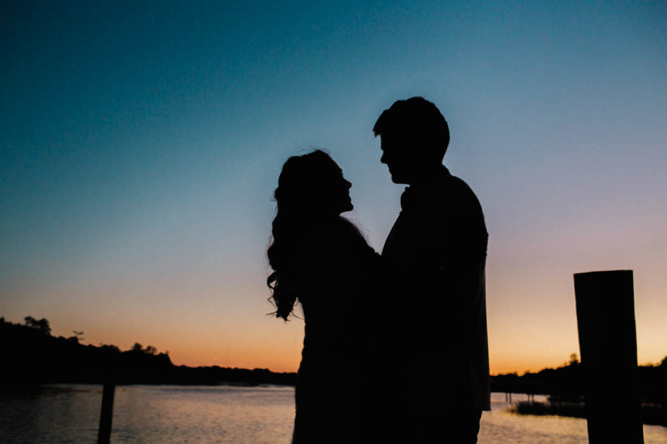 Bride and groom stand on dock at sunset, Boone Hall Plantation, Charleston, South Carolina. Kate Timbers Photography. http://katetimbers.com #katetimbersphotography // Charleston Photography // Inspiration