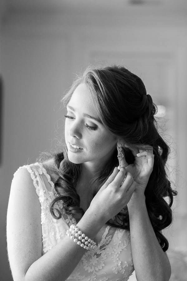 Bride puts on earrings, Isle of Palms, Charleston, South Carolina. Kate Timbers Photography. http://katetimbers.com #katetimbersphotography // Charleston Photography // Inspiration