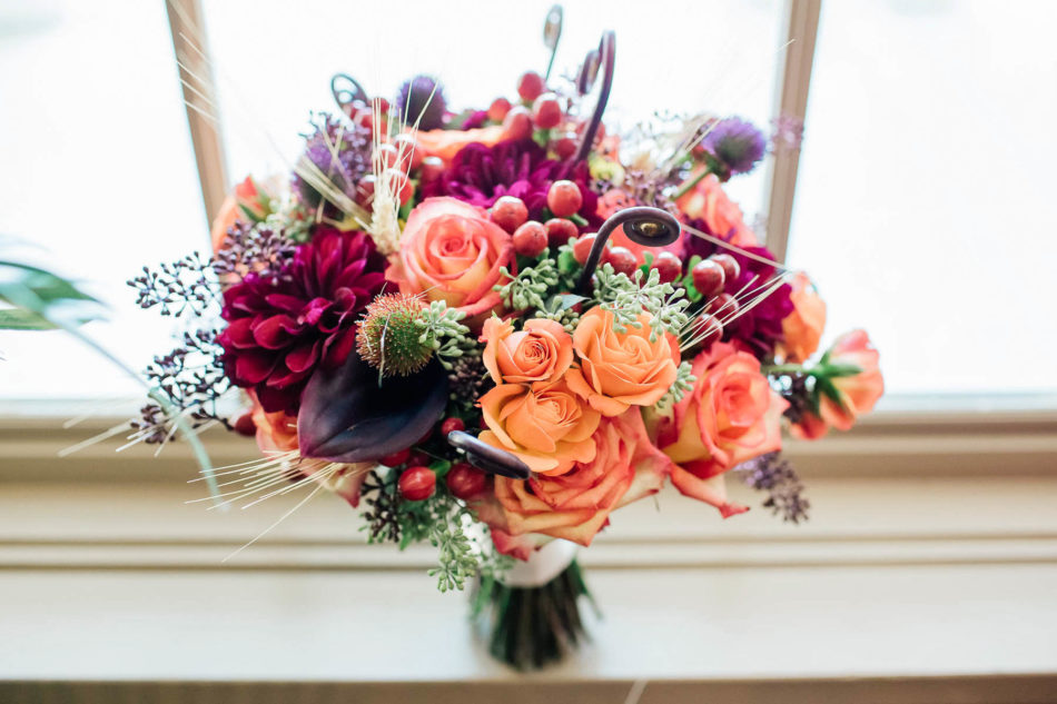 Bouquet has orange and maroon flowers, Indigo Run Clubhouse, Hilton Head, South Carolina Kate Timbers Photography. http://katetimbers.com #katetimbersphotography // Charleston Photography // Inspiration
