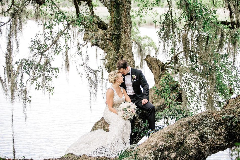 Bride and groom pose by oak tree and water, Magnolia Plantation, Charleston, South Carolina Kate Timbers Photography. http://katetimbers.com #katetimbersphotography // Charleston Photography // Inspiration